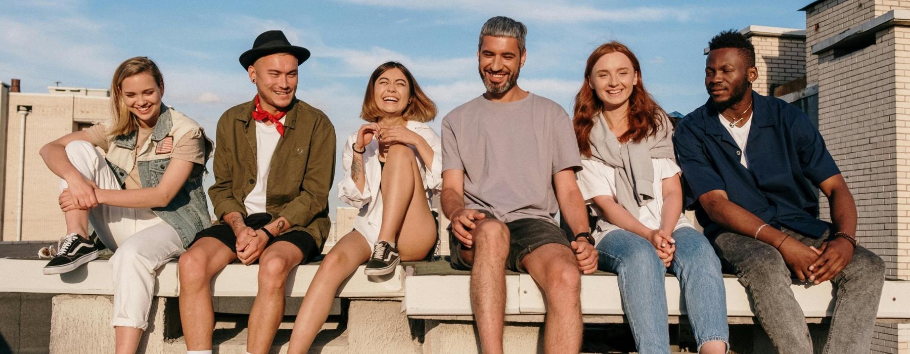 a group of people sitting on a bench