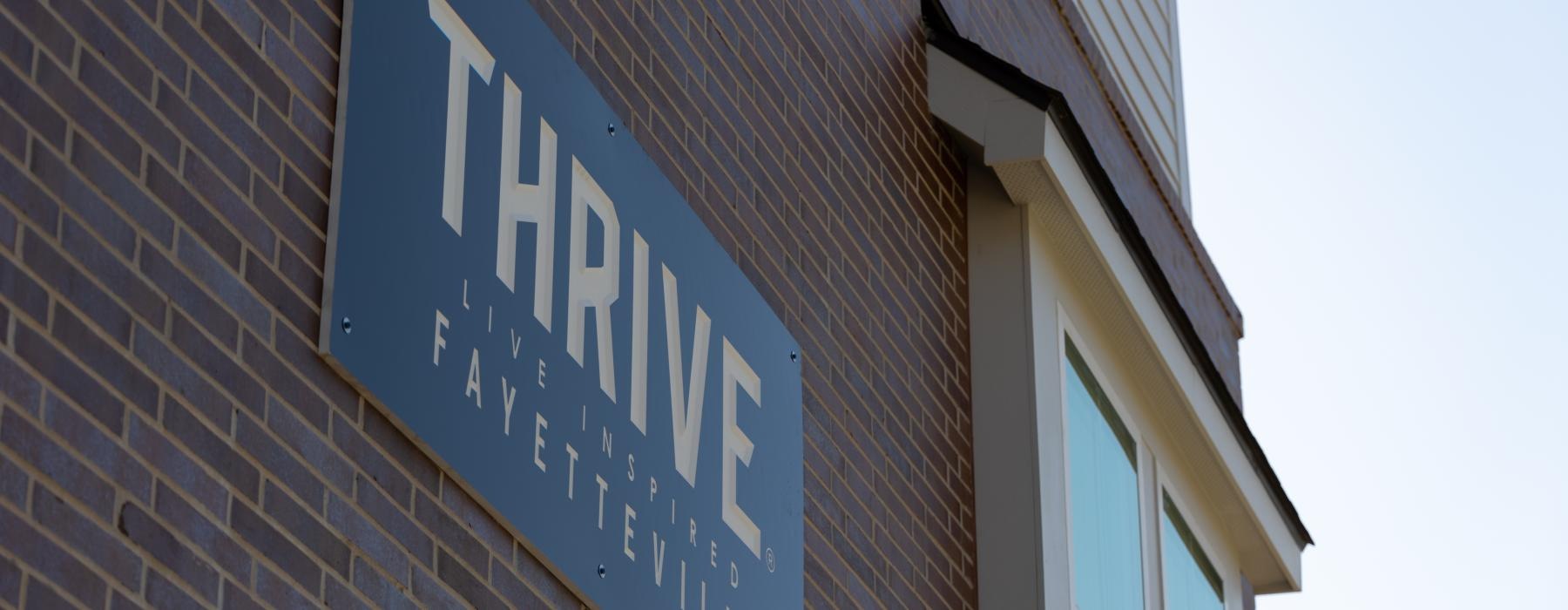 a sign on a brick building