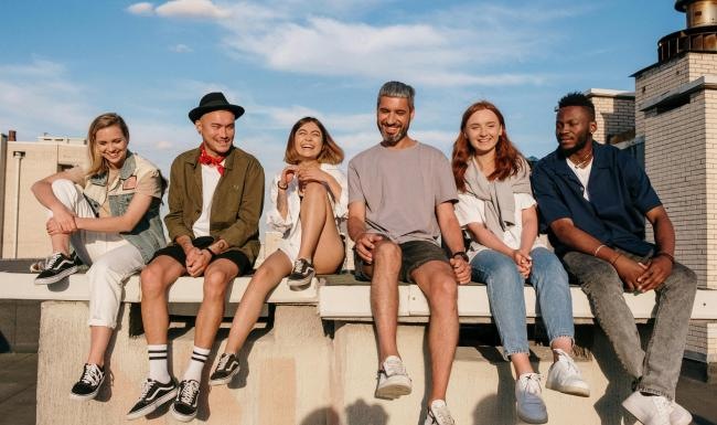 a group of people sitting on a bench