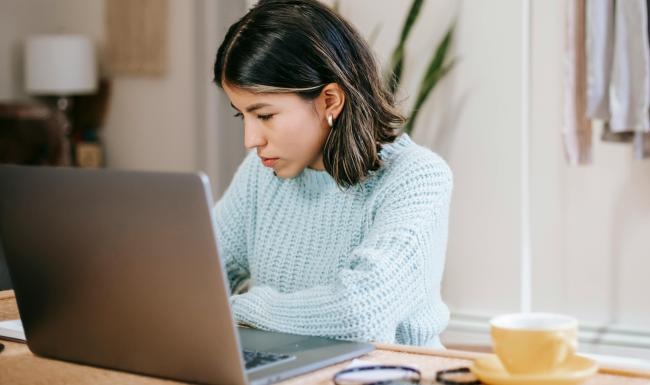 a woman working on her laptop