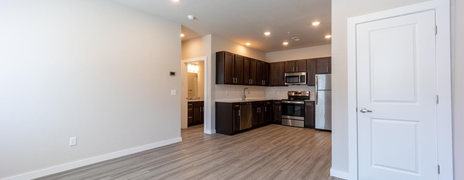 a large kitchen with wooden floors