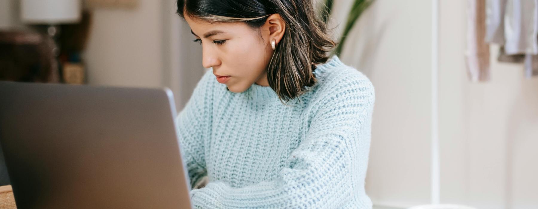 a woman working on her laptop