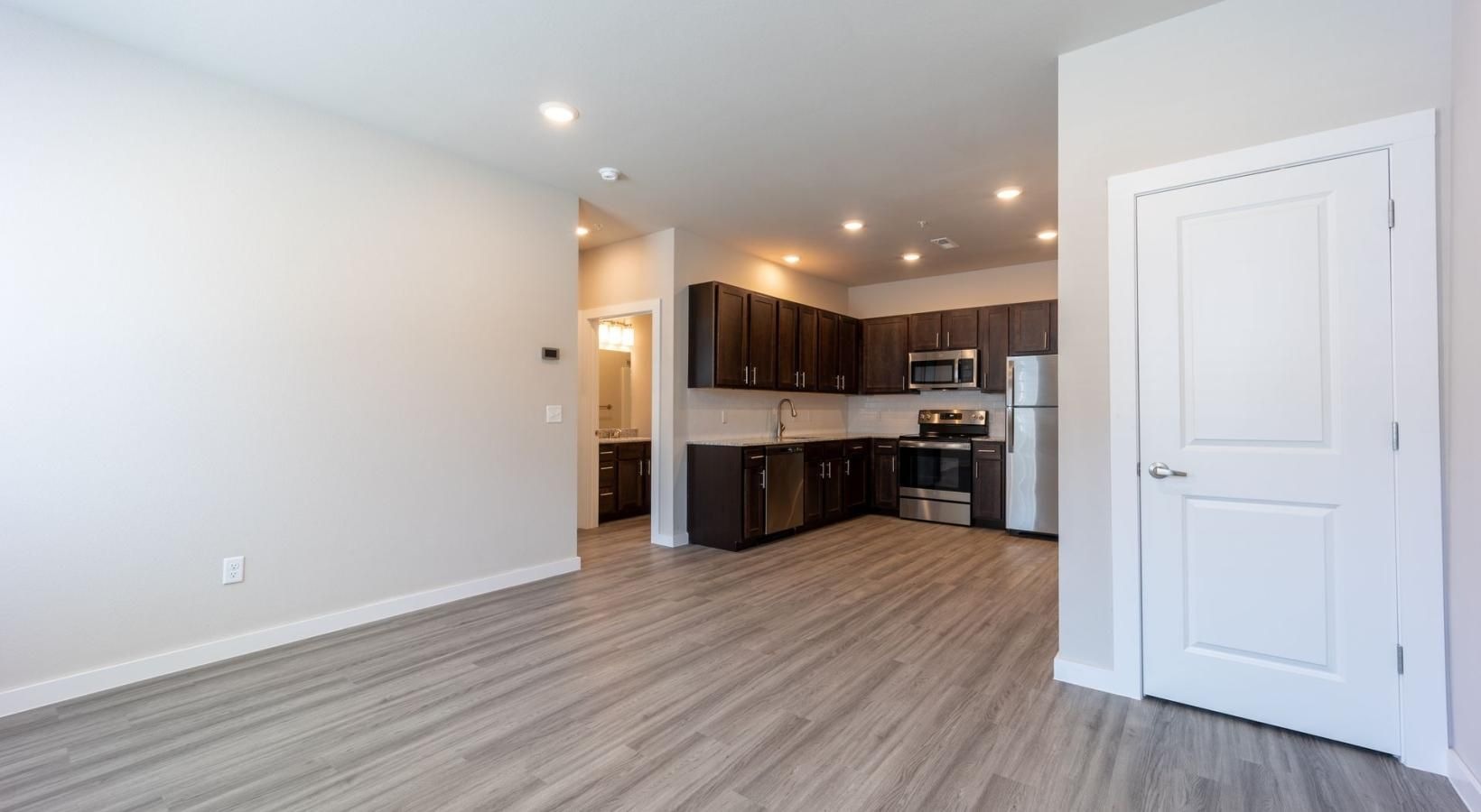 a large kitchen with wooden floors