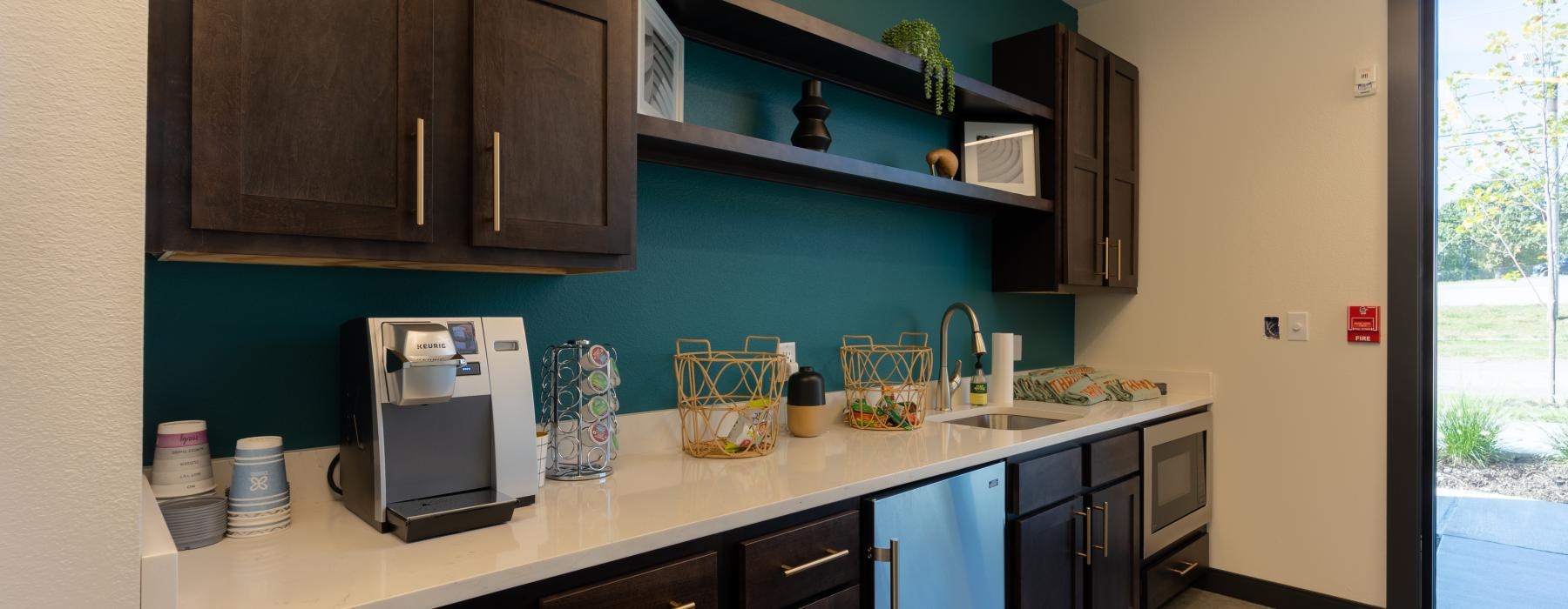 a kitchen with blue cabinets